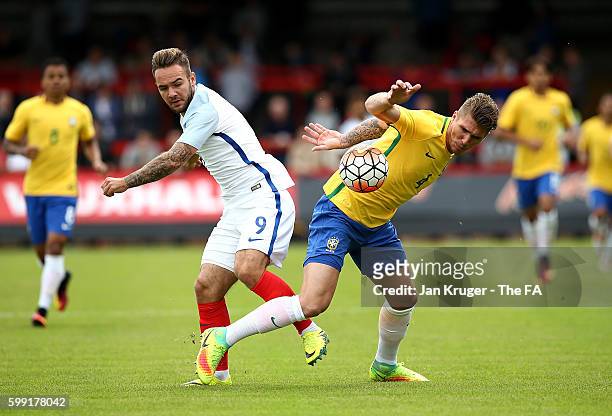 Adam Armstrong of England U20 battles with Lyanco of Brazil U20 during the International match between England U20 and Brazil U20 at Aggborough...