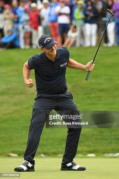 Alex Noren of Sweden celebrates victory after sinking a long putt on the the first extra hole during the final round of the Omega European Masters at...