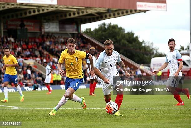 Adam Armstrong of England U20 battles with Lyanco of Brazil U20 during the International match between England U20 and Brazil U20 at Aggborough...