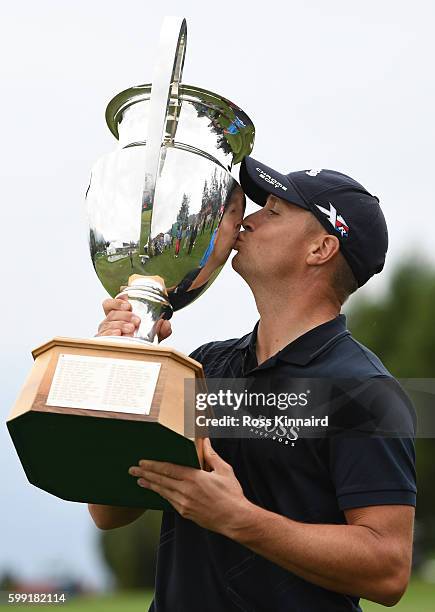 Alex Noren of Sweden kisses the trophy folowing his victory during the final round of the Omega European Masters at Crans-sur-Sierre Golf Club on...