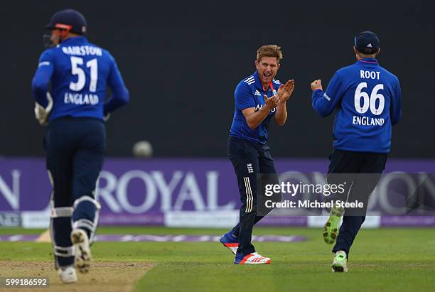 Liam Dawson of England celebrates towards Joe Root after taking the wicket of Shoaib Malik during the 5th Royal London One-Day International match...