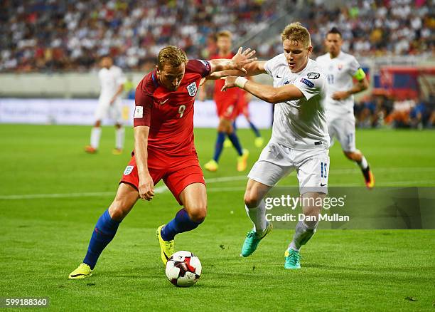 Harry Kane of England holds off Tomas Hubocan of Slovakia during the 2018 FIFA World Cup Group F qualifying match between Slovakia and England at...