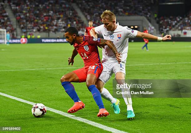 Theo Walcott of England holds off Tomas Hubocan of Slovakia during the 2018 FIFA World Cup Group F qualifying match between Slovakia and England at...