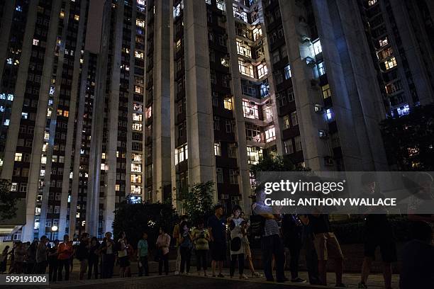 People queue to vote shortly before polls officialy close during the Legislative Council election in Hong Kong late on September 4, 2016. Young Hong...