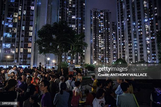 People queue to vote shortly before polls officialy close during the Legislative Council election in Hong Kong late on September 4, 2016. Young Hong...