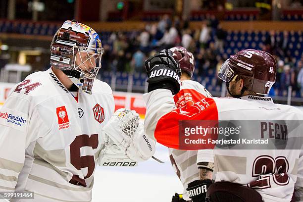 Toms Popperle goalkeeper of Sparta Prague thanks Lukas Pech of Sparta Prague after the Champions Hockey League match between Farjestad Karlstad and...