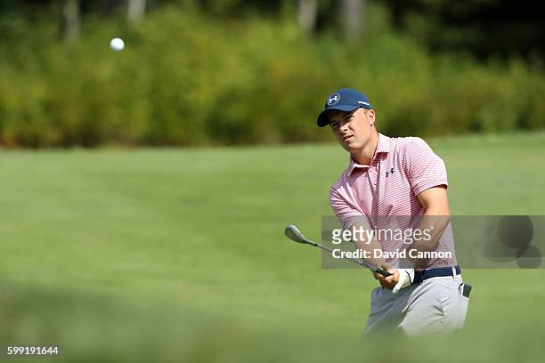 Jordan Spieth plays a shot on the fourth hole during the third round of the Deutsche Bank Championship at TPC Boston on September 4, 2016 in Norton,...