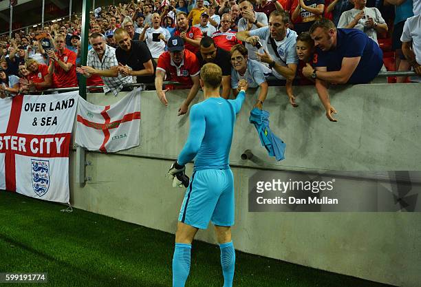 Joe Hart of England passes his shirt ot a fan after the 2018 FIFA World Cup Group F qualifying match between Slovakia and England at City Arena on...