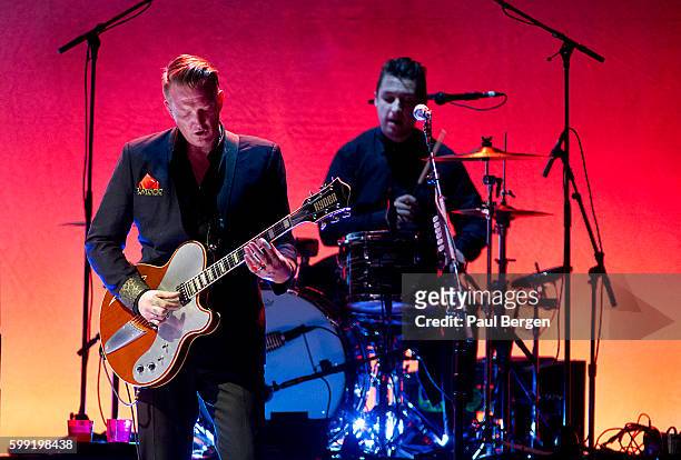 Josh Homme and Matt Helders perform on stage with Iggy Pop at Heineken Music Hall, Amsterdam, Netherlands, 10th May 2016.