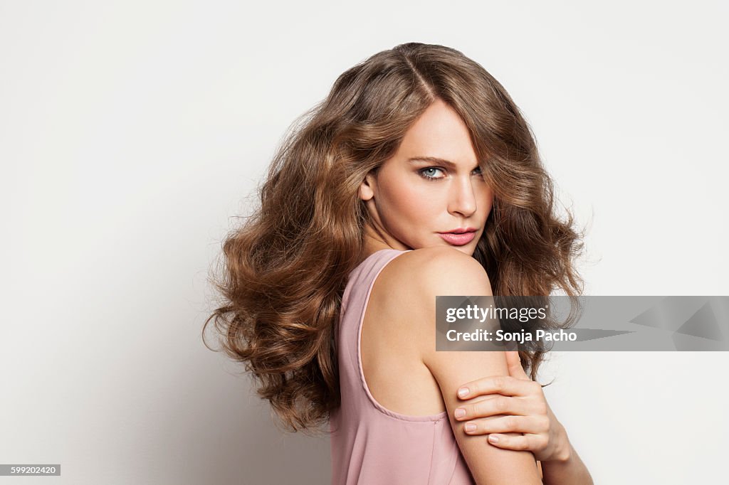 Studio portrait of young brunette woman