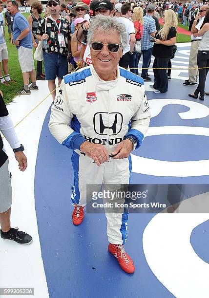 Mario Andretti strolls through the infield area before MAVTV 500 driver introductions before a race held at the Auto Club Speedway in Fontana, CA.