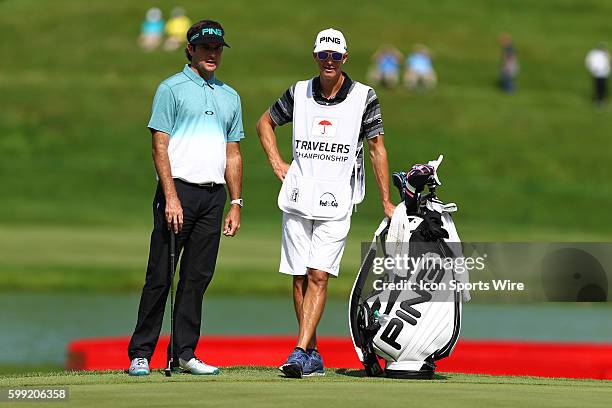 Bubba Watson with his caddie on the green at 17 during the second round of the Travelers Championship at TPC River Highlands in Cromwell, CT. Bubba...