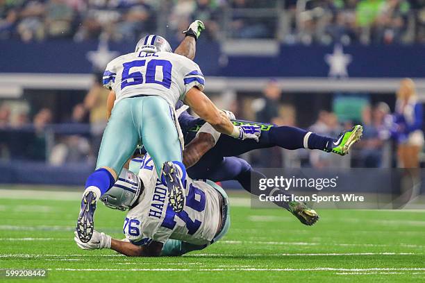 Seattle Seahawks running back Marshawn Lynch gets tackled by Dallas Cowboys defensive end Greg Hardy and outside linebacker Sean Lee during the game...