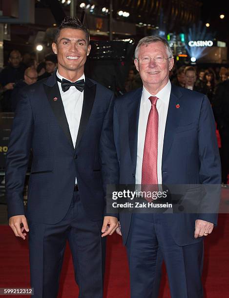 Cristiano Ronaldo and Sir Alex Ferguson arriving at the World Premiere of "Ronaldo" at the Vue West End in London