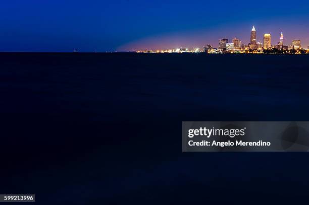 cleveland skyline at night - angelo merendino stock pictures, royalty-free photos & images