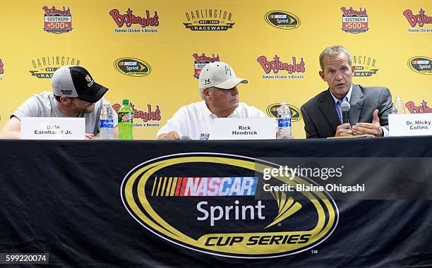 Dr. Micky Collins of the University of Pittsburgh Medical Center Sports Medicine Concussion Program, speaks as Dale Earnhardt Jr. And Rick Hendrick,...