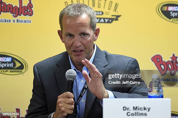 Dr. Micky Collins of the University of Pittsburgh Medical Center Sports Medicine Concussion Program, speaks during a press conference with Dale...