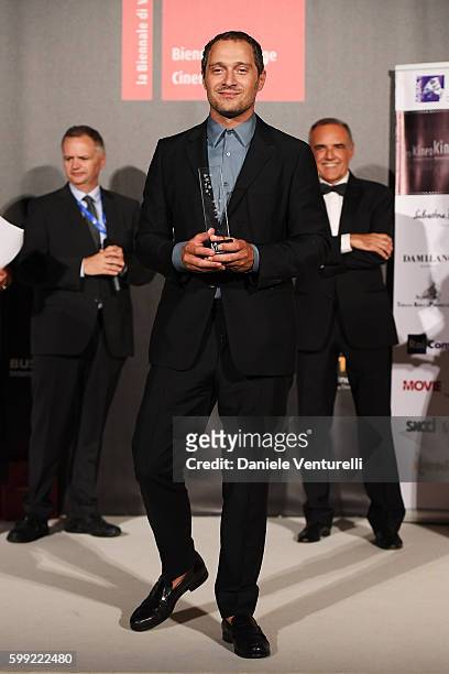 Claudio Santamaria receives the Best Actor Award at the Kineo Diamanti Award Ceremony during the 73rd Venice Film Festival on September 4, 2016 in...