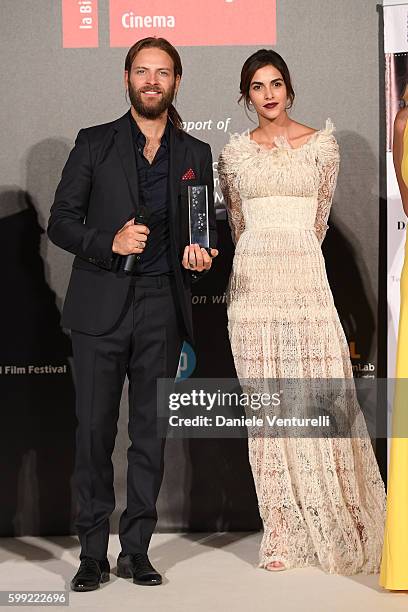 Alessandro Borghi receives the 'Best Supporting Actor' Award from Rocio Munoz Morales at the Kineo Diamanti Award Ceremony during the 73rd Venice...