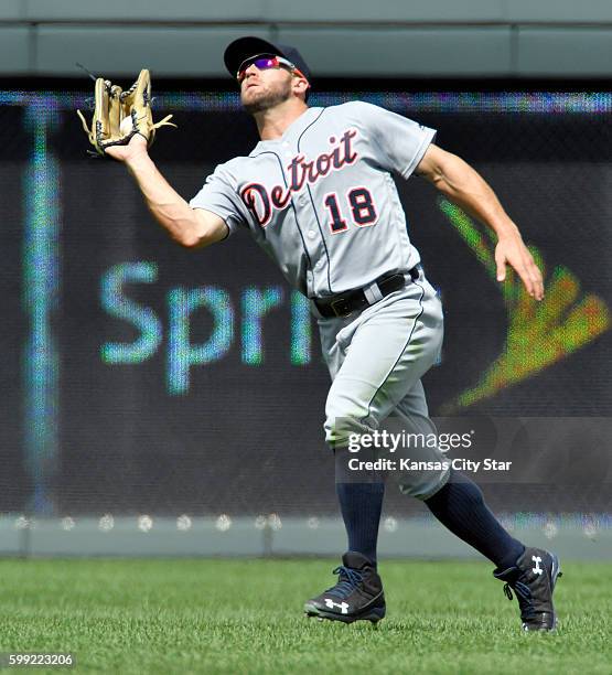 Detroit Tigers center fielder Tyler Collins catches a fly ball for an out on Kansas City Royals' Salvador Perez to end the fourth inning on Sunday,...