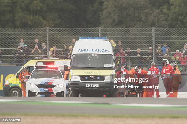 The ambulance with Loris Baz of France and Avintia Racing after crashed out during the MotoGP race during the MotoGp Of Great Britain - Race at...