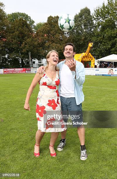 Stefanie von Poser and Markus Brandl, , die Bergretter, during the charity football game 'Kick for Kids' to benefit 'Die Seilschaft - zusammen sind...