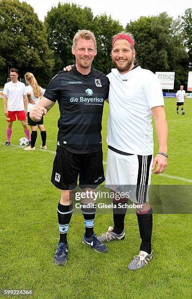 Martin Gruber and Sebastian Stroebel, the former 'Bergretter' and the new one during the charity football game 'Kick for Kids' to benefit 'Die...