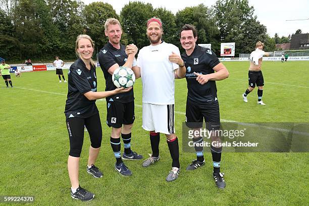 Stefanie von Poser , Martin Gruber and Sebastian Stroebel, the former 'Bergretter' and the new one and Markus Brandl during the charity football game...