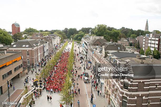 Over 1800 Redhead guests pose for a group photo at "Redhead Days" on September 4, 2016 in Breda, Netherlands. The 11th annual festival welcomes red...