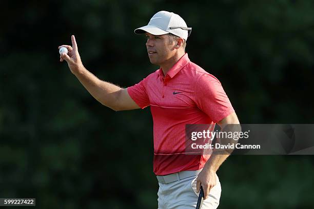 Paul Casey of England acknowledges the crowd on the 18th green during the third round of the Deutsche Bank Championship at TPC Boston on September 4,...