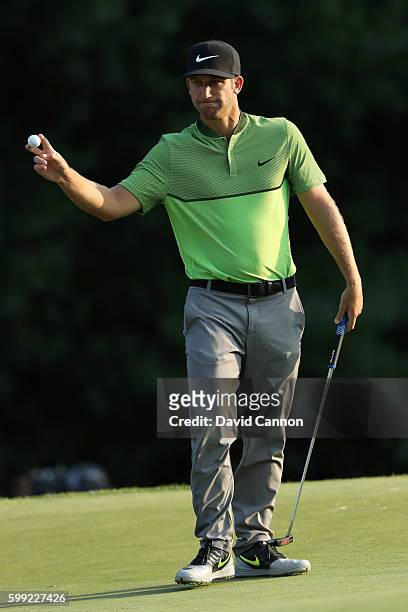 Kevin Chappell acknowledges the crowd on the 18th green during the third round of the Deutsche Bank Championship at TPC Boston on September 4, 2016...