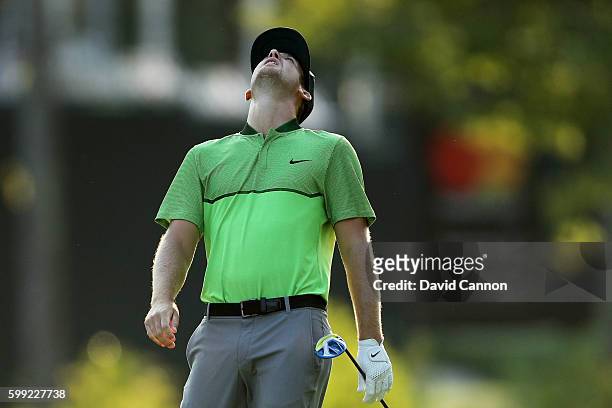 Kevin Chappell reacts to his shot from the 18th fairway during the third round of the Deutsche Bank Championship at TPC Boston on September 4, 2016...