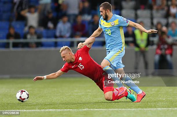 Kamil Glik , Sergei Khizhnichenko , during the World Cup 2018 football qualification match between Kazakhstan and Poland in Astana, Kazakistan on...