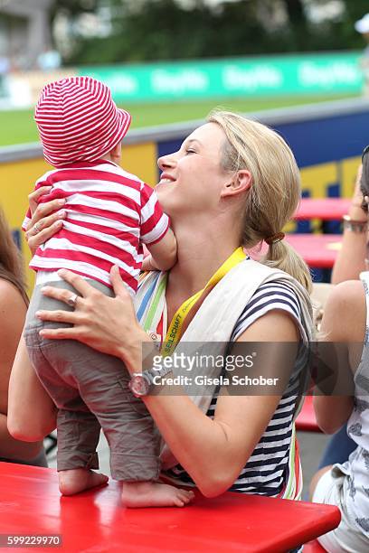Eva-Maria Grein and her baby son Jonathan during the charity football game 'Kick for Kids' to benefit 'Die Seilschaft - zusammen sind wir stark e.V.'...
