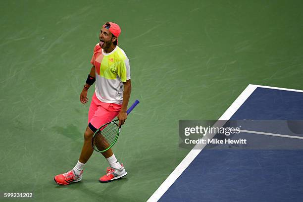 Lucas Pouille of France reacts after defeating Rafael Nadal of Spain during his fourth round Men's Singles match on Day Seven of the 2016 US Open at...