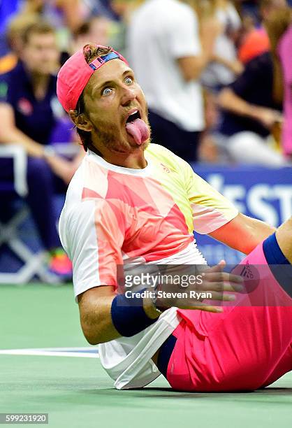 Lucas Pouille of France reacts after defeating Rafael Nadal of Spain during his fourth round Men's Singles match on Day Seven of the 2016 US Open at...