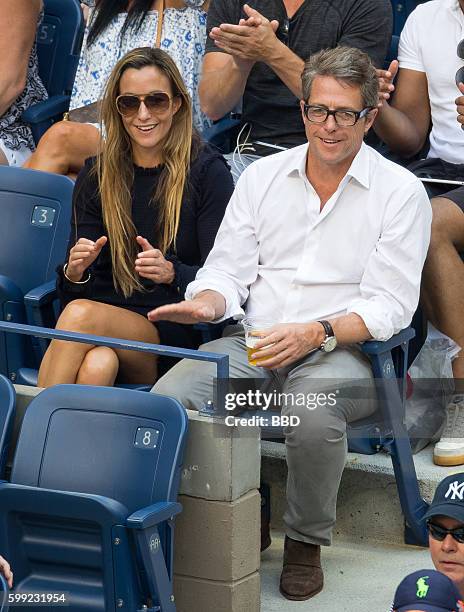 Hugh Grant and Anna Eberstein seen at USTA Billie Jean King National Tennis Center on September 4, 2016 in the Queens borough of New York City.