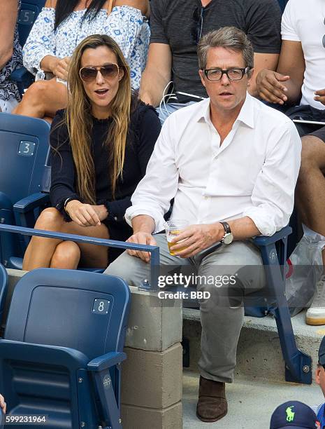 Hugh Grant and Anna Eberstein seen at USTA Billie Jean King National Tennis Center on September 4, 2016 in the Queens borough of New York City.