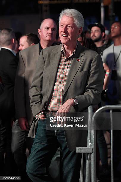 Former President Bill Clinton watches Chance the Rapper's set during the 2016 Budweiser Made in America Festival at Benjamin Franklin Parkway on...