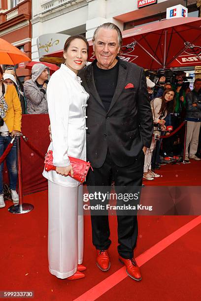 Juergen Hunke and his wife Chun Li attend the 'Nacht der Legenden' at Schmidts Tivoli on September 04, 2016 in Hamburg, Germany.