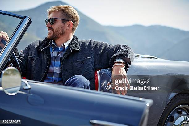 man goes on road trip in countryside - wristwatch stock pictures, royalty-free photos & images