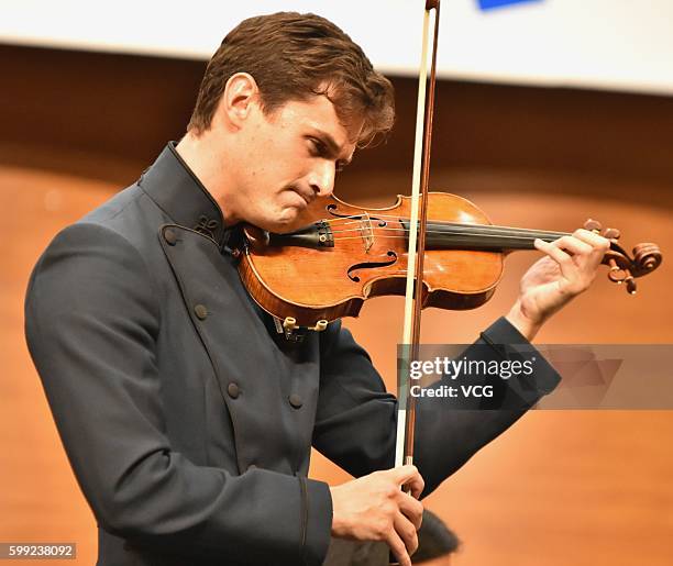 British violinist Charlie Siem performs onstage in his national tour on September 3, 2016 in Nanjing, Jiangsu Province of China.