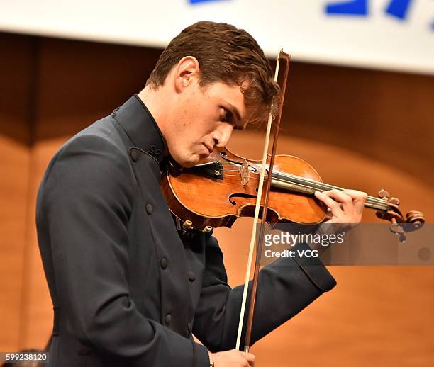 British violinist Charlie Siem performs onstage in his national tour on September 3, 2016 in Nanjing, Jiangsu Province of China.