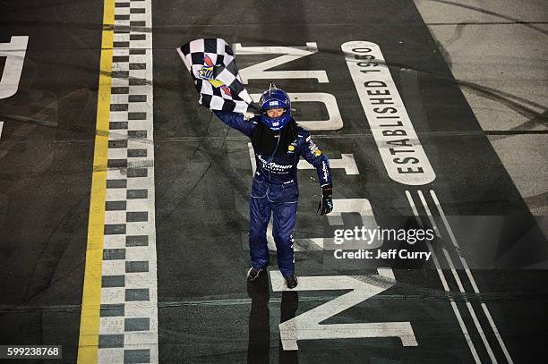 Martin Truex, Jr., driver of the Auto-Owners Insurance Toyota, celebrates after winning the NASCAR Sprint Cup Series Bojangles' Southern 500 at...