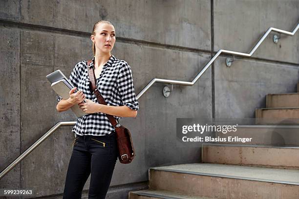 young woman at university - three quarter length stock pictures, royalty-free photos & images