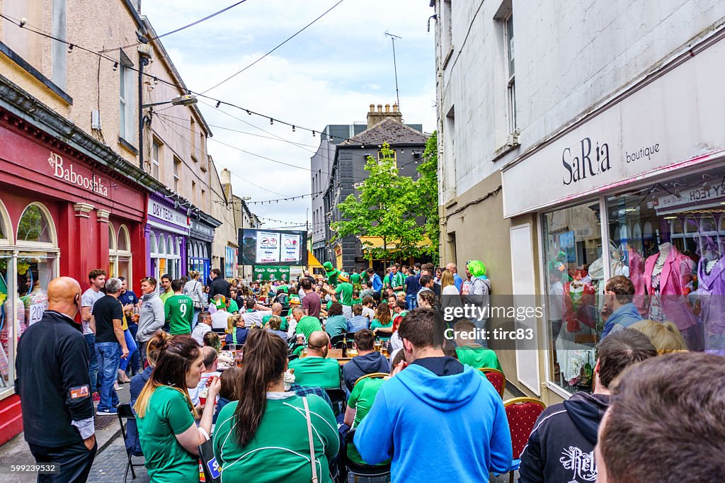 People sitting outside Irish pub in Wexford town centre