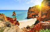 Rocky beach at sunset, Lagos, Portugal