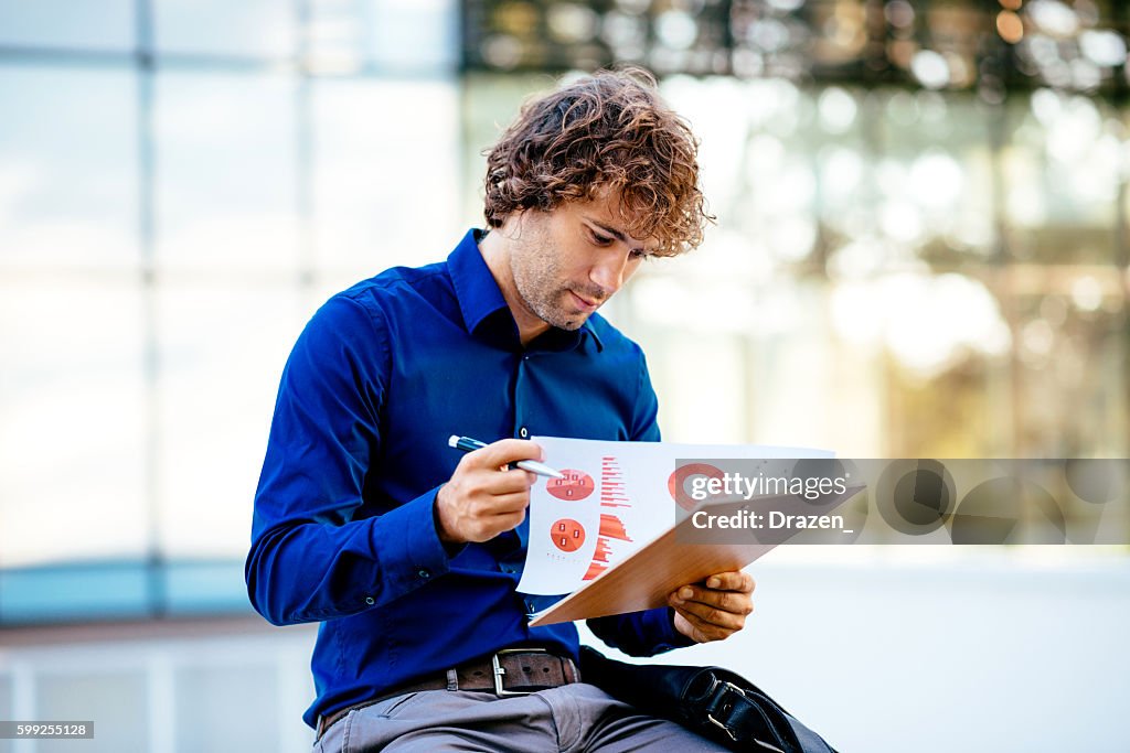 Portrait of pensive businessman dealing with financial markets