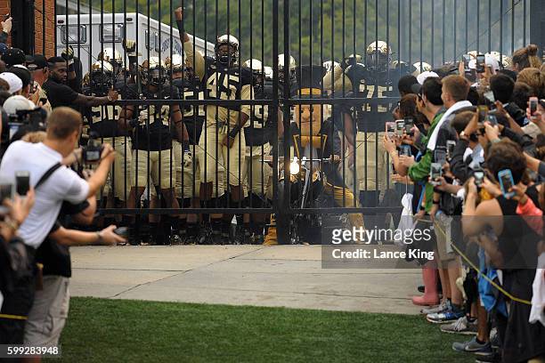 The mascot and players of the Wake Forest Demon Deacons prepare to enter the stadium prior to their game against the Tulane Green Wave at BB&T Field...