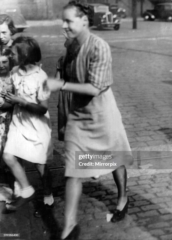 The Thetis disaster. Mrs Bolus wife of the commanding officer of HMS Thetis seen here comforting the children of the men